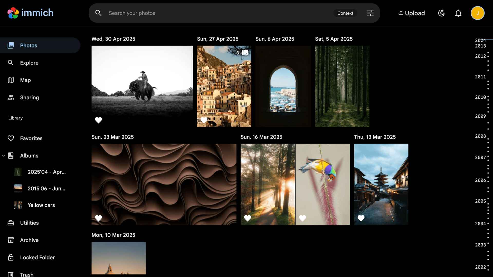Immich Photos library on the public demo with timeline thumbnails, albums sidebar, and search (same UI as a self-hosted instance)